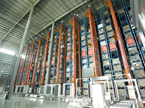 Industrial warehouse storage system with towering metal racks and automated retrieval machinery.