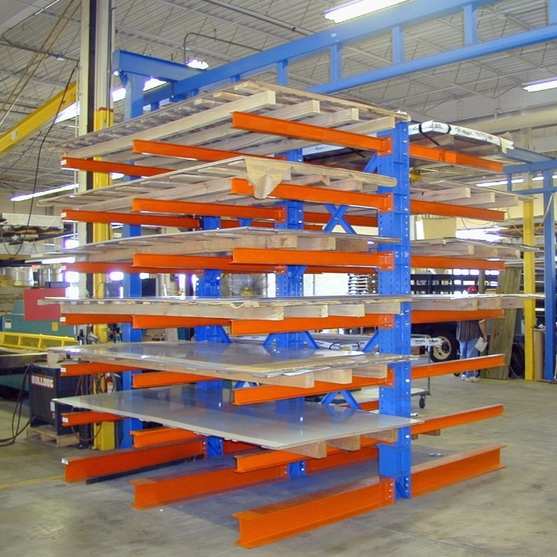 Cantilever racking system with horizontal arms extending from vertical columns for efficient storage of long and bulky items in warehouses.